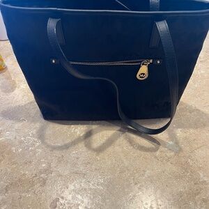 Michael Kors purse black although it looks blue in the picture